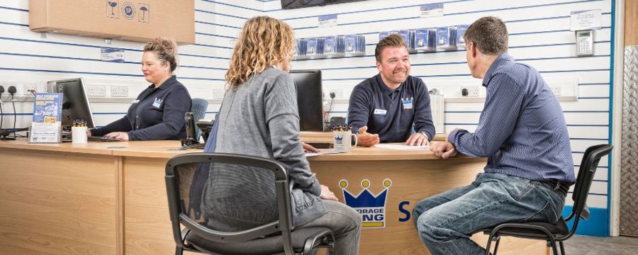 A couple sitting at a Storage King facility