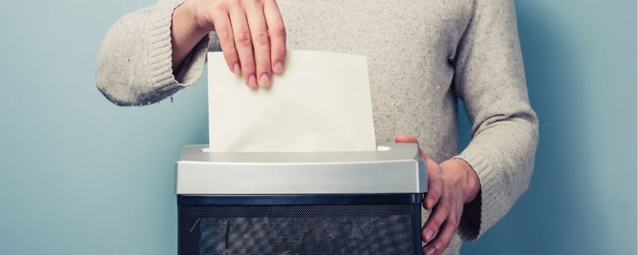 A person shredding documents
