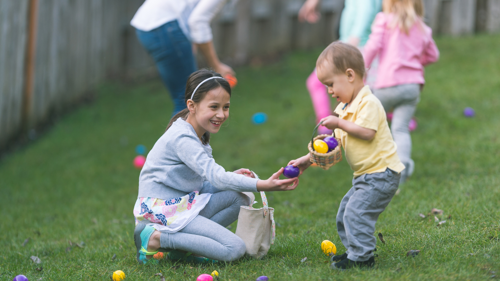 Children collecting eggs on easter egg hunt