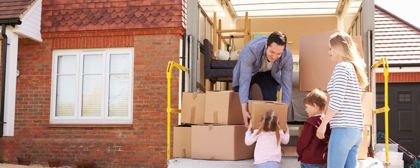 Happy Family Packing Their Moving Van