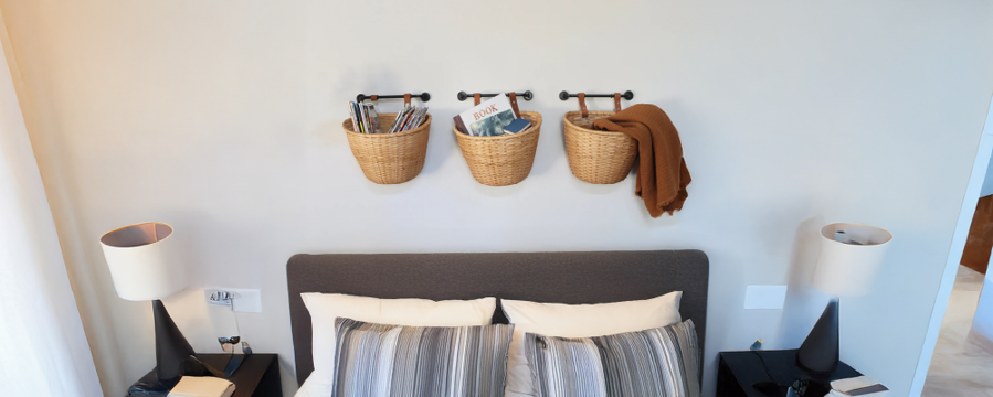 image of wall-mounted basket storage above bed