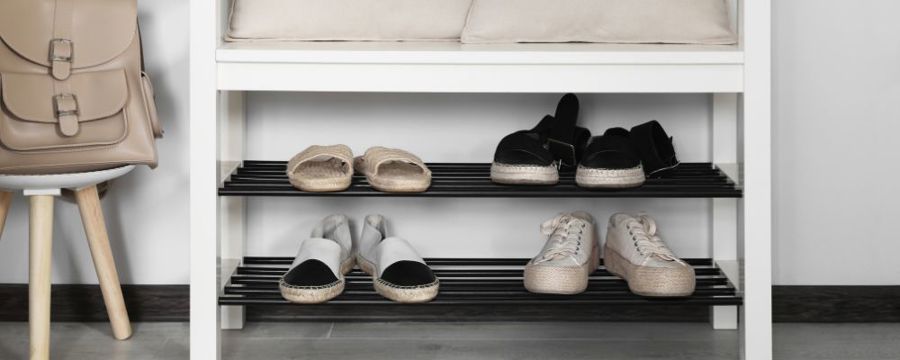 shoes neatly placed on a shoe rack
