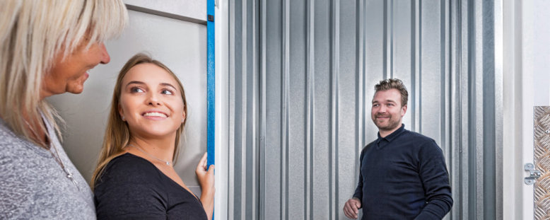 A couple discussing self storage with a Storage King store manager