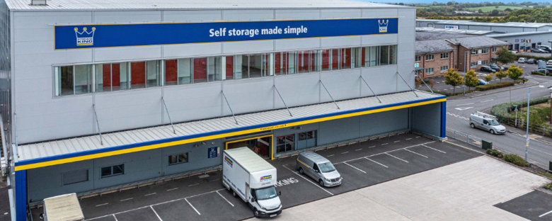 The exterior of Storage King Frome with moving vans in the parking lot