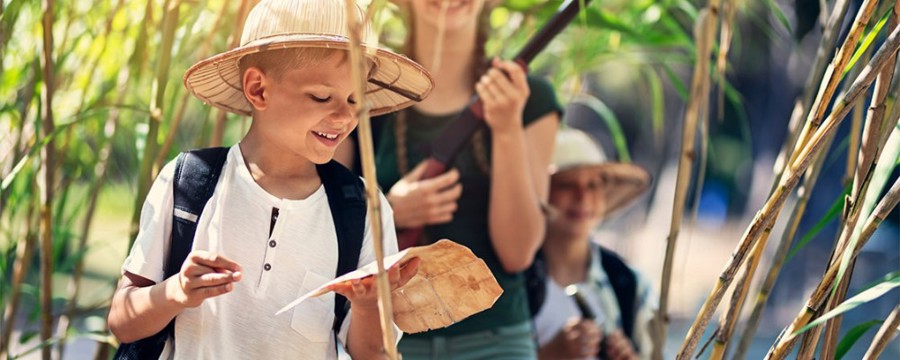 kids go on a scavenger hunt outside in nature