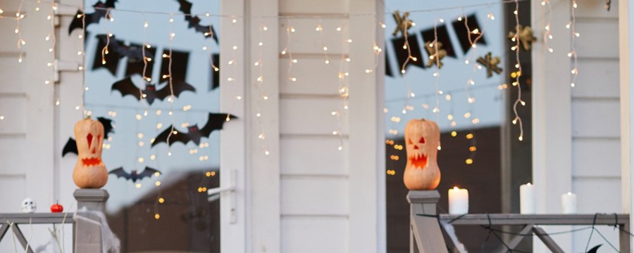 Paper bats hanging outside a house