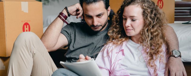 Couple with a moving house checklist