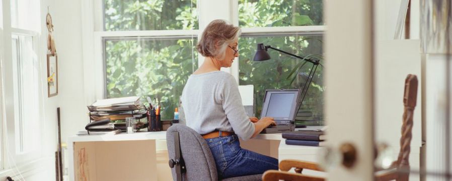 Women using a window sill desk