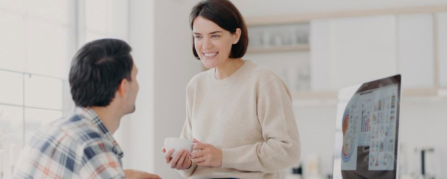 A young couple discussing wedding dress storage
