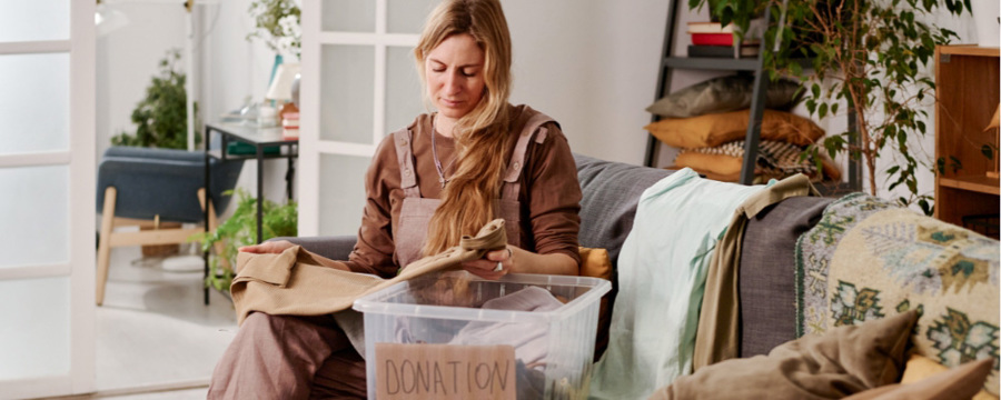 woman-going-through-her-household-items-decluttering