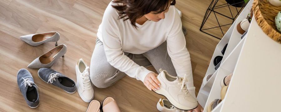 women sorting out her shoes