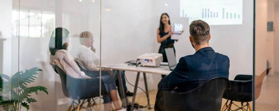 A person standing in front of a person in a room

AI-generated content may be incorrect.