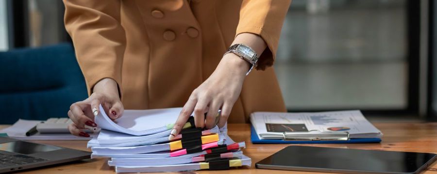 A person going through documents to be shredded