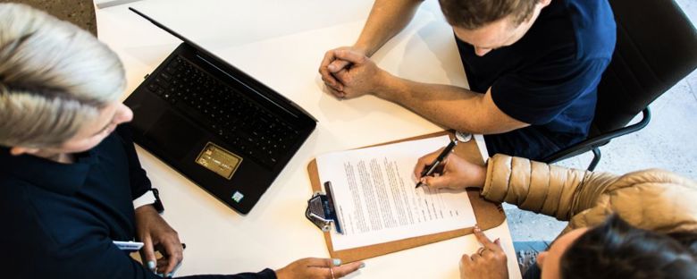 Signing a contract at Storage King