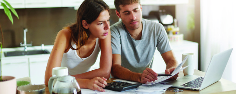 A couple discussing their finances to plan for moving and storage