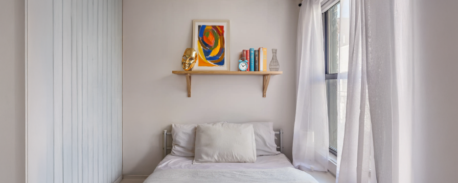 Image showing how floating above a bed shelves can be used for simple storage