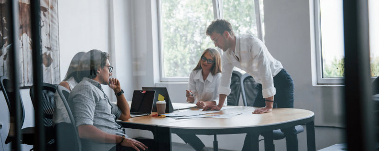 A business meeting where staff are discussing self storage solutions