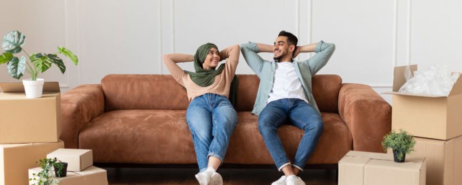 Couple in new home unpacking