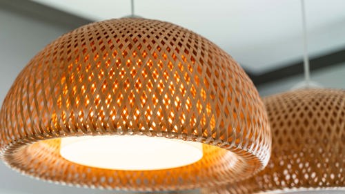 a pendant light made from woven bamboo