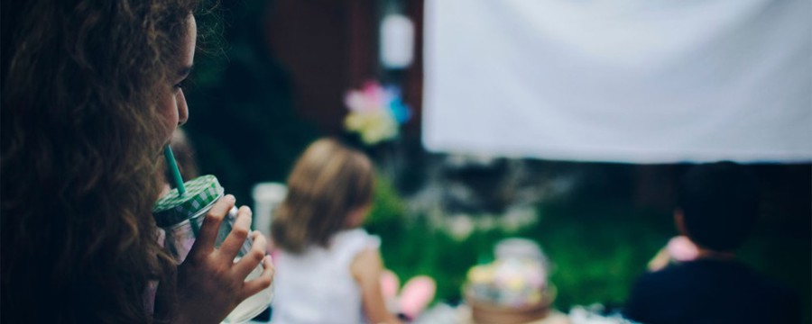 kids have an outdoor movie night during the summer holiday