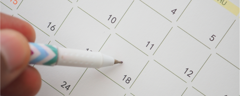 A person marking off dates on their calendar, determining how many days they need self storage for