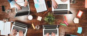 Top View Of A Team Working Around A Table